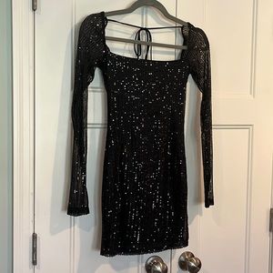 Sequined, long (sheer) sleeved, body con mini dress. Sized small. Never worn.